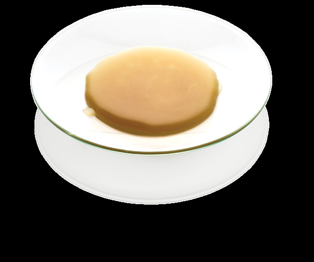 Finished topical balm in a laboratory dish